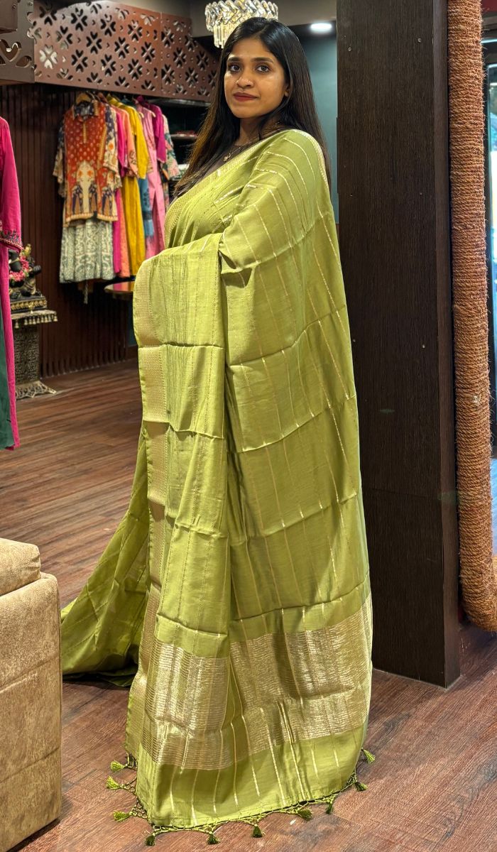 Orange Assam Silk Saree, Beautifully Detailed with Zari Designs All Over Its Body, Highlighted by a Zari Border of Traditional Designs, a Gleaming Pallu of Ogee Patterns, and Paired with a Matching Blouse main image 0